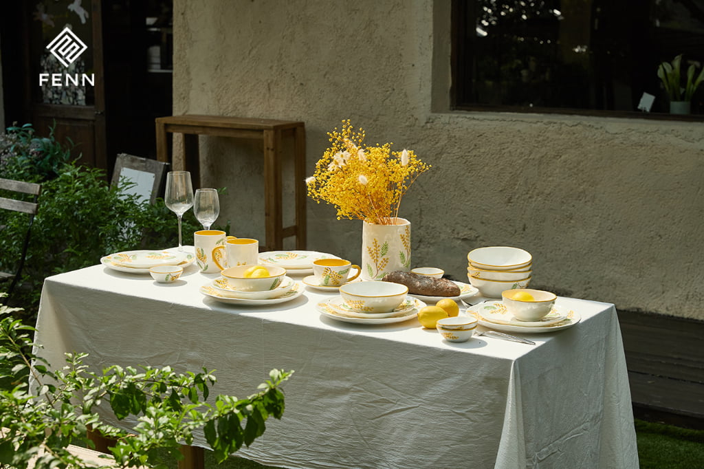 Decorative ceramic vase coordinated with a hand-painted tableware collection