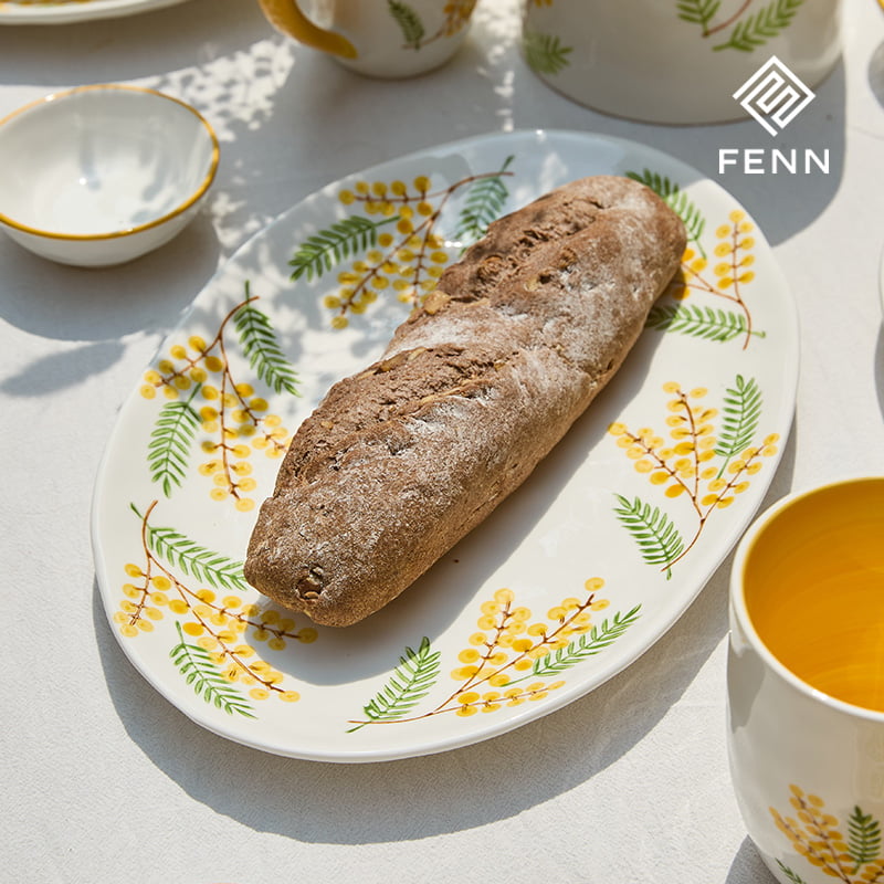 Hand-painted oval ceramic serving platter for a coordinated collection